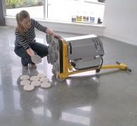 Mechanically polishing a concrete floor